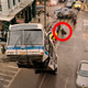 A bus is attacked in the street by an invisible octopus.